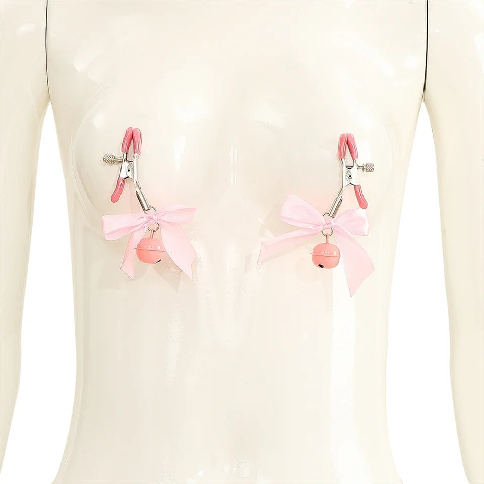 Pretty metal clamps covered in rubber. The clamp has a screw that allows you to adjust its clamping power to your specific tastes. The end of each clip is decorated with a small satin bow and a matching colored bell.
