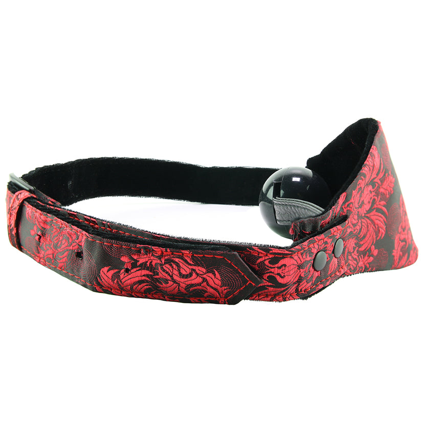 Absolutely beautiful, extra sexy, and perfect for playful mates with a little kink up their sleeves, the erotically inspirational Scandal line puts its signature lacy red print and creative design stamp on a favorite piece of play gear. Very effectively restraining the wearer - orally, at least! - the Hidden Pleasure Ball Gag silences sound and discourages spitting, biting and other various forms of oral disobedience.