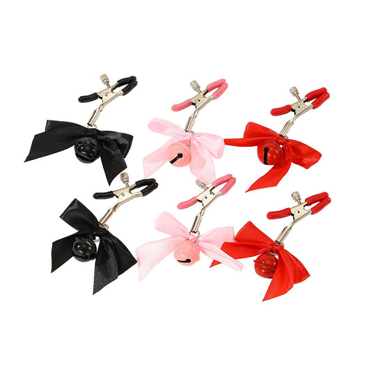 Pretty metal clamps covered in rubber. The clamp has a screw that allows you to adjust its clamping power to your specific tastes. The end of each clip is decorated with a small satin bow and a matching colored bell.