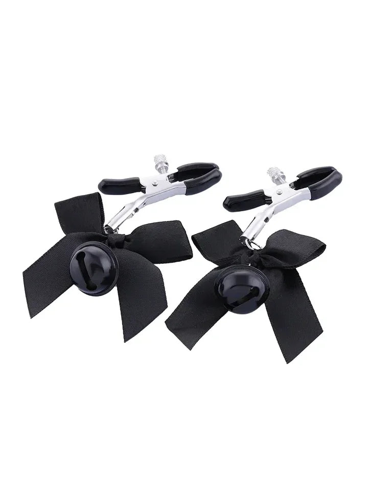 Pretty metal clamps covered in rubber. The clamp has a screw that allows you to adjust its clamping power to your specific tastes. The end of each clip is decorated with a small satin bow and a matching colored bell.
