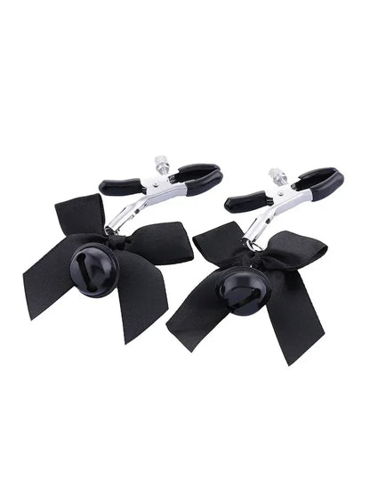 Pretty metal clamps covered in rubber. The clamp has a screw that allows you to adjust its clamping power to your specific tastes. The end of each clip is decorated with a small satin bow and a matching colored bell.