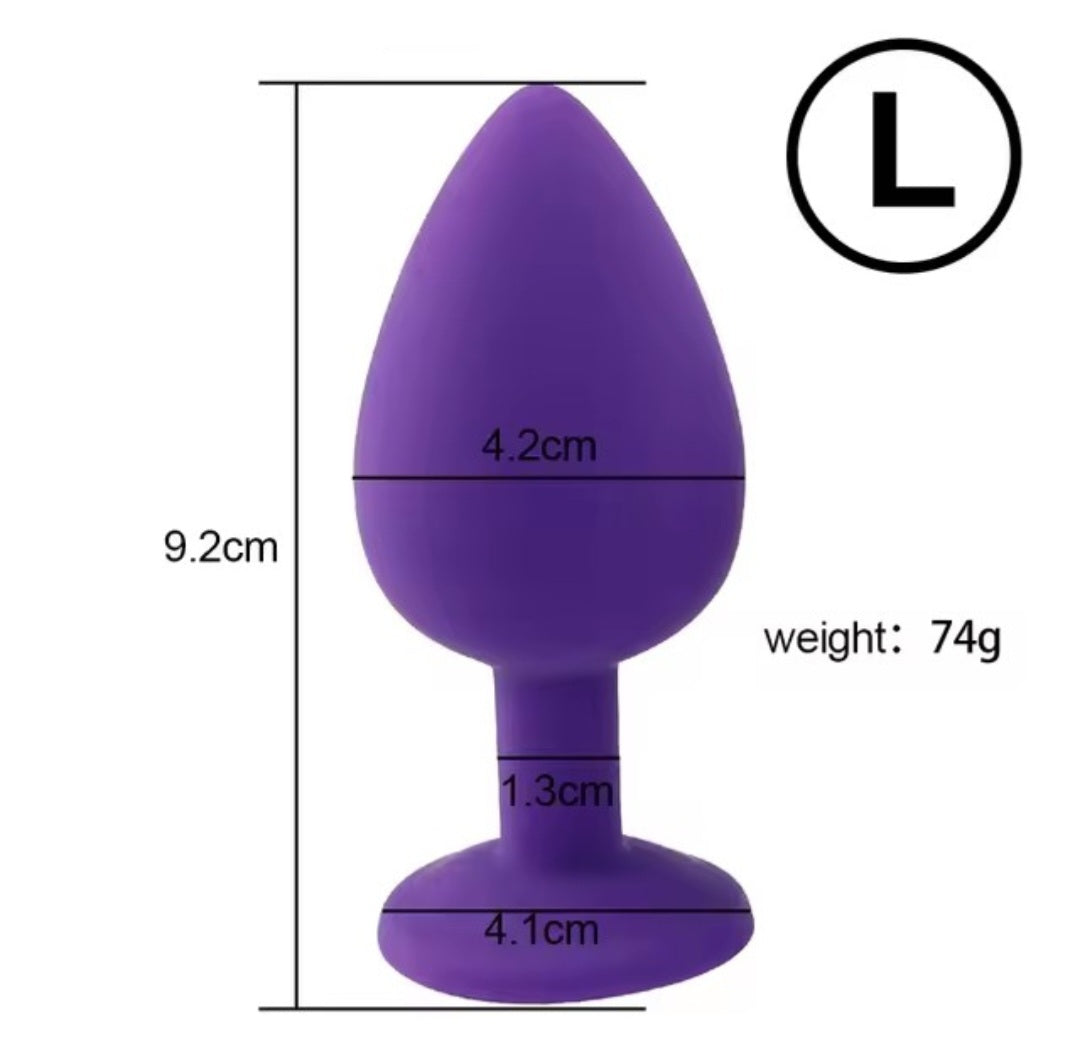 Large silicone butt plug with silver gem in purple