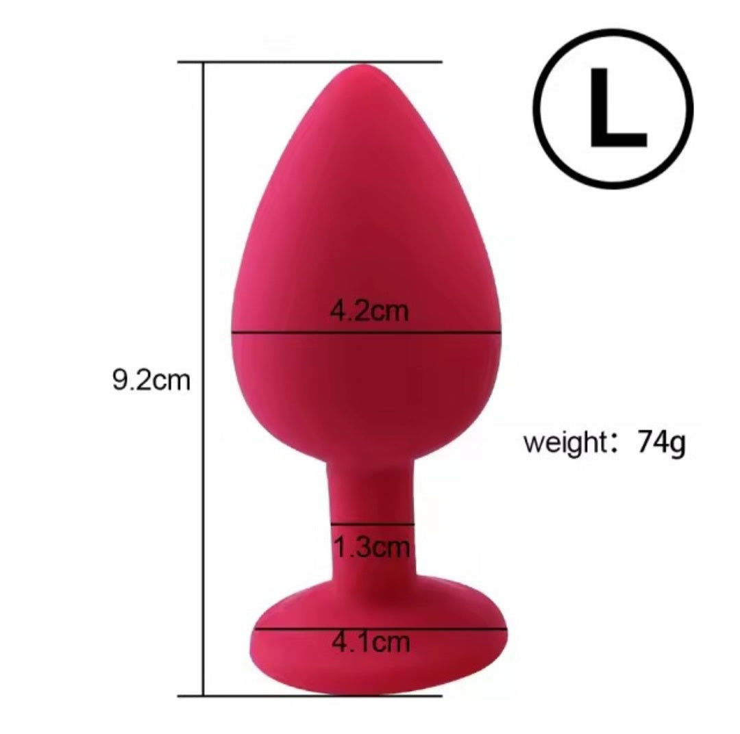 Large silicone butt plug with silver gem in red