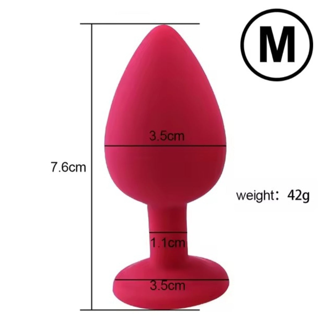 Medium silicone butt plug with silver gem in red