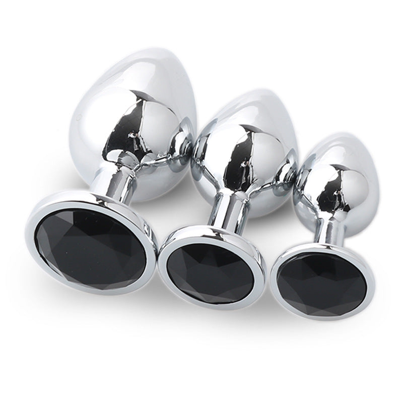 Metal anal plug set with three sizes and matching gem bases
