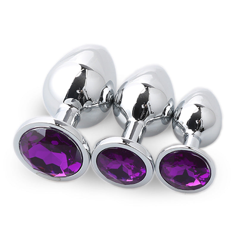 Metal anal plug set with three sizes and matching gem bases