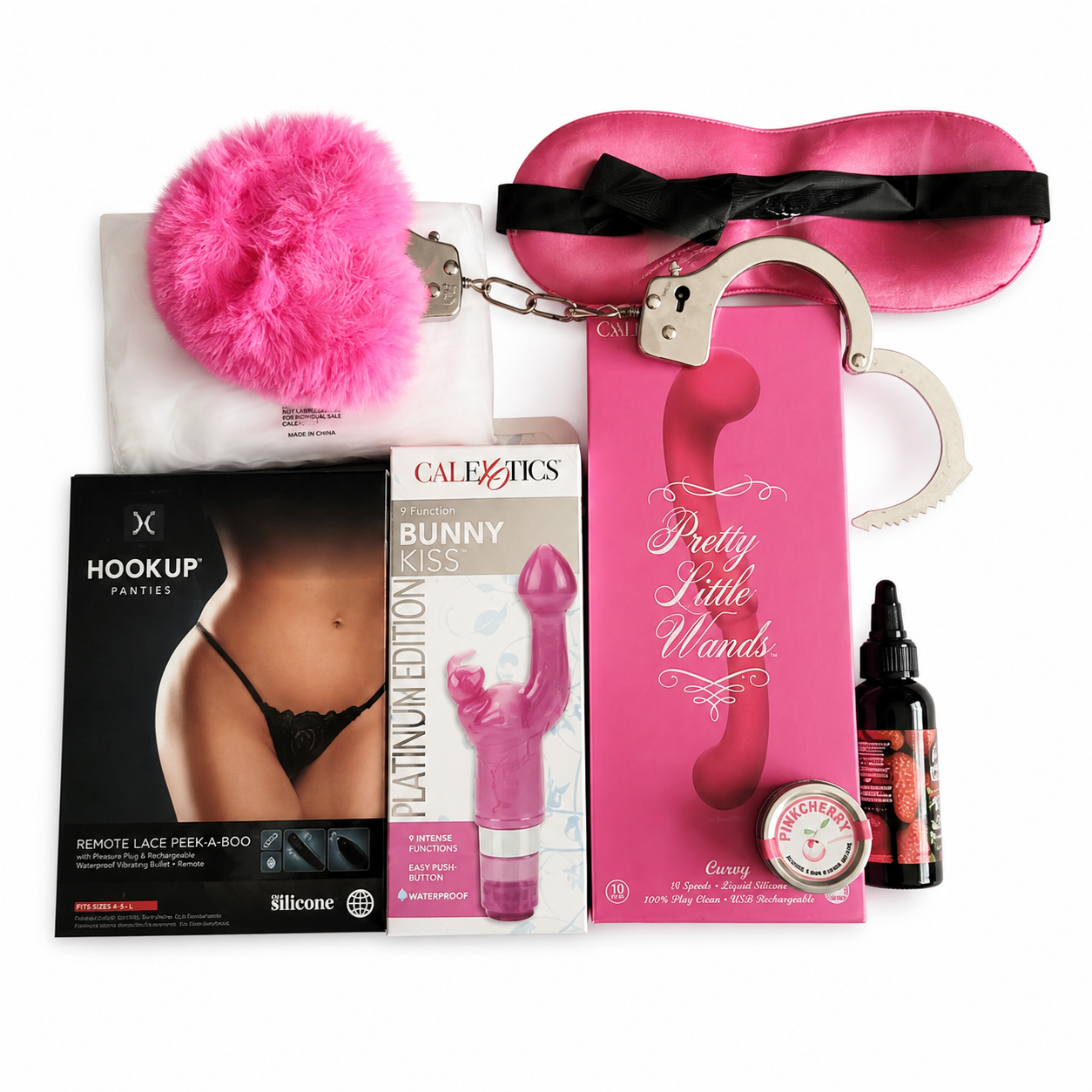 Pink pleasure kit with fishnet dress, remote control panties, wand massager, handcuffs, satin blindfold and romantic accessories
