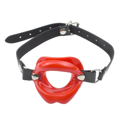 Combining soft faux leather leather with a tasteless silicone kiss. Uniquely styled, the soft Lips Gag holds the wearer's lips open, stifling sound and preventing biting, spitting and otherwise.