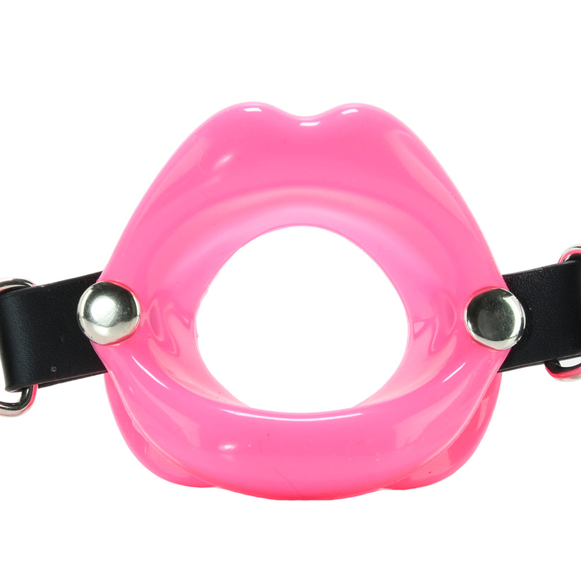 Combining soft faux leather leather with a tasteless silicone kiss. Uniquely styled, the soft Lips Gag holds the wearer's lips open, stifling sound and preventing biting, spitting and otherwise.