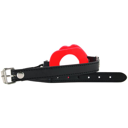 Combining soft faux leather leather with a tasteless silicone kiss. Uniquely styled, the soft Lips Gag holds the wearer's lips open, stifling sound and preventing biting, spitting and otherwise.