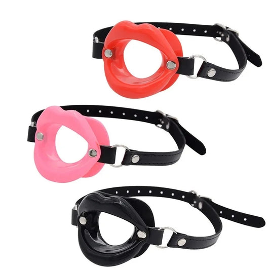 Combining soft faux leather leather with a tasteless silicone kiss. Uniquely styled, the soft Lips Gag holds the wearer's lips open, stifling sound and preventing biting, spitting and otherwise.