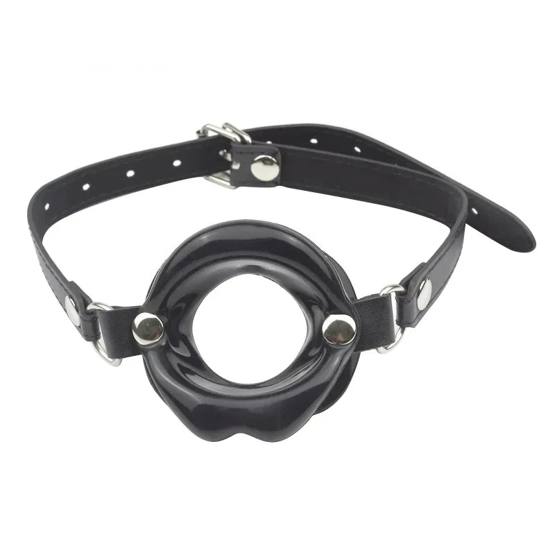 Combining soft faux leather leather with a tasteless silicone kiss. Uniquely styled, the soft Lips Gag holds the wearer's lips open, stifling sound and preventing biting, spitting and otherwise.