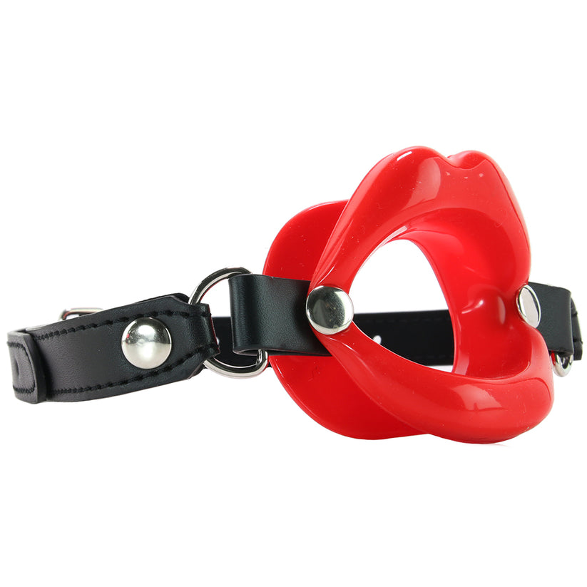 Combining soft faux leather leather with a tasteless silicone kiss. Uniquely styled, the soft Lips Gag holds the wearer's lips open, stifling sound and preventing biting, spitting and otherwise.