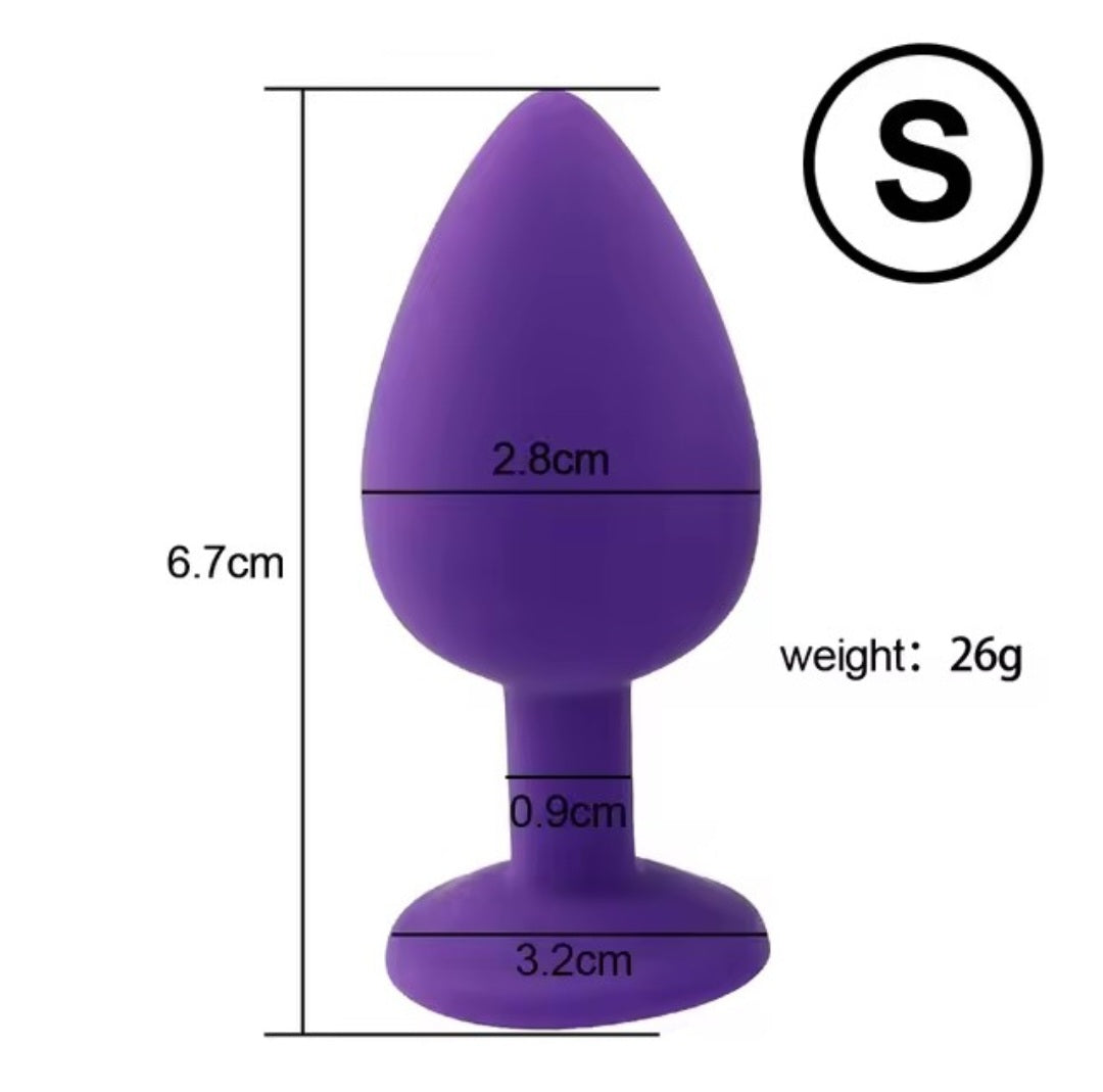 Small silicone butt plug with silver gem in purple