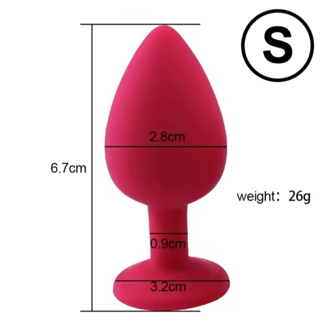 Small silicone butt plug with silver gem in red